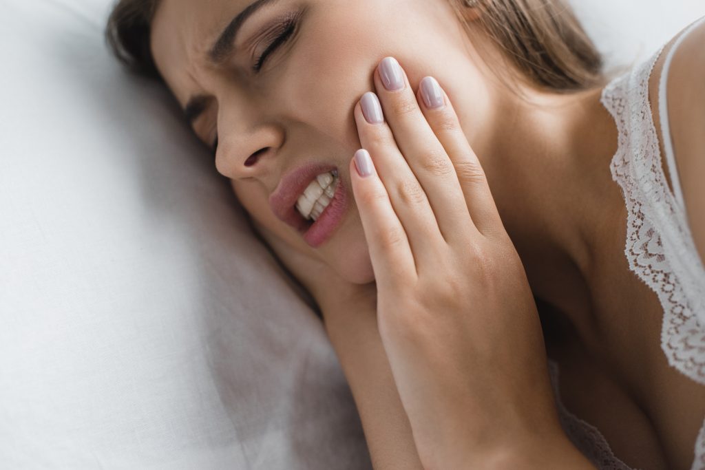 Woman suffering from bruxism